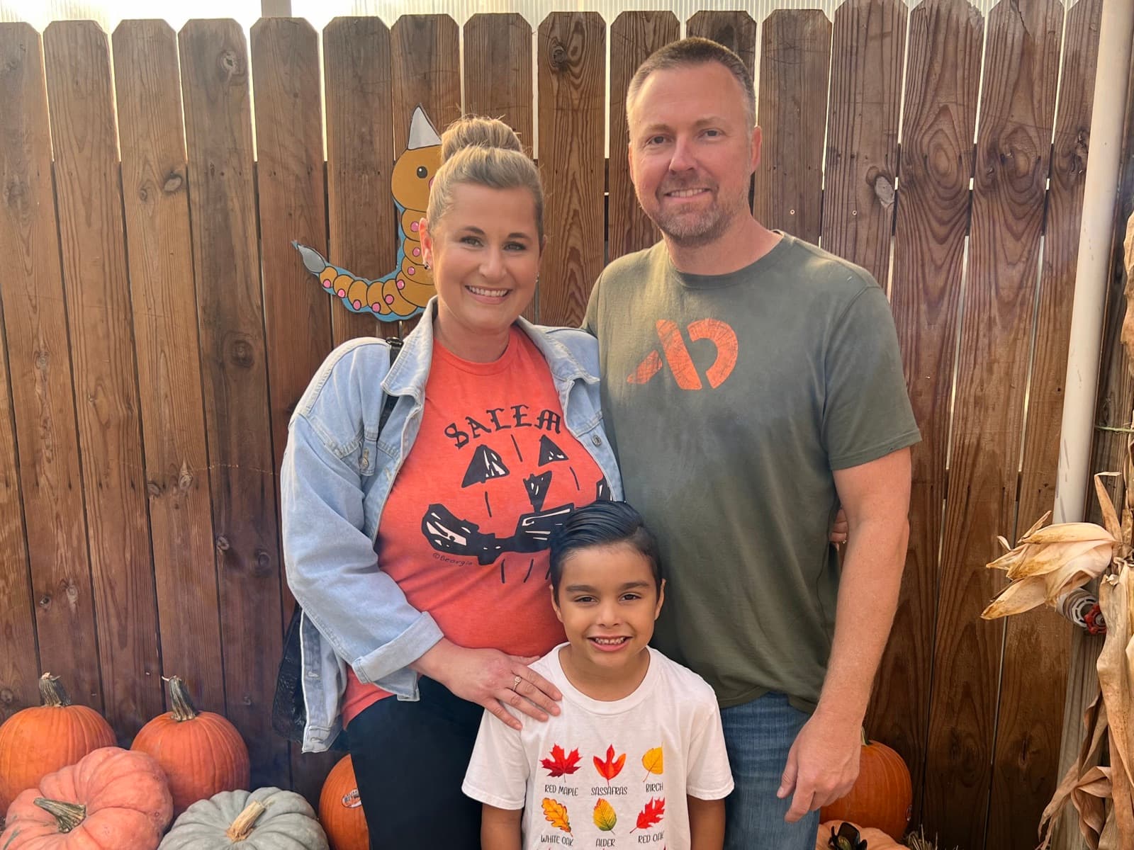 Kenny Buelterman with his wife Jackie and son Fisher at a pumpkin patch